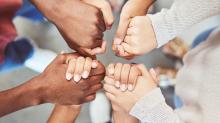 Photo of women holding hands